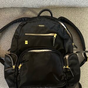 Tumi Black and Gold Voyager Carson Backpack
